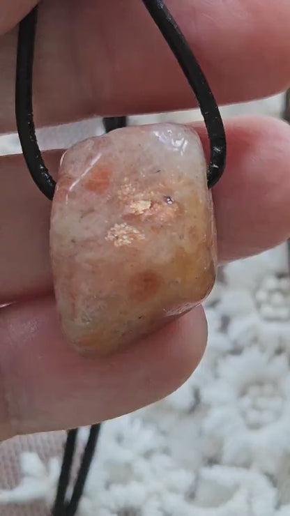 Sunstone pendant, 28 x 18 x 15 mm, drilled, on adjustable leather strap